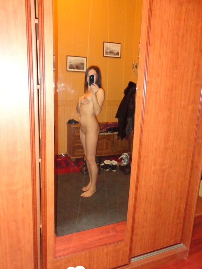 Hot teen shows her body in the mirror