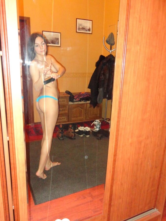 Hot teen shows her body in the mirror