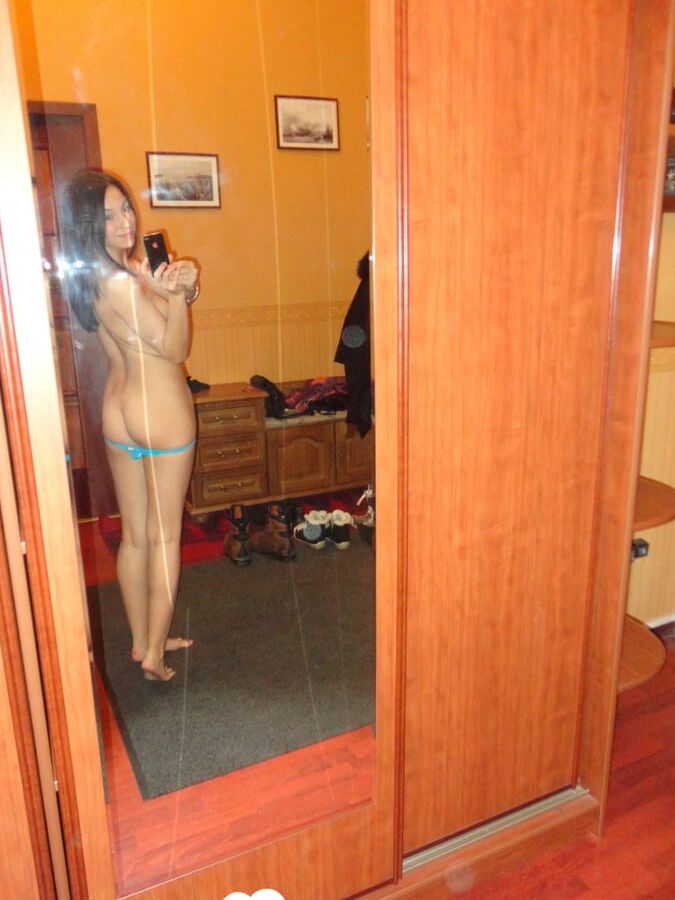 Hot teen shows her body in the mirror