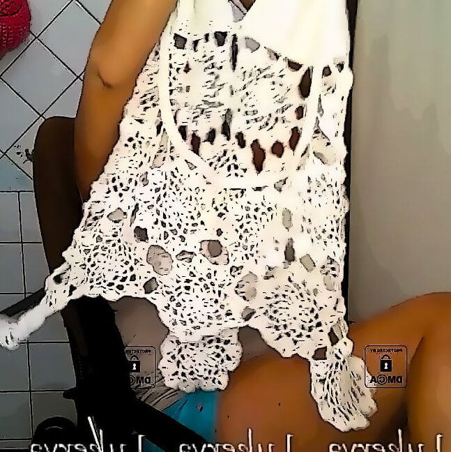 Lukerya in an openwork white dress