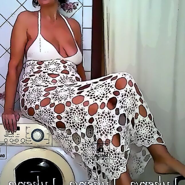 Lukerya in an openwork white dress