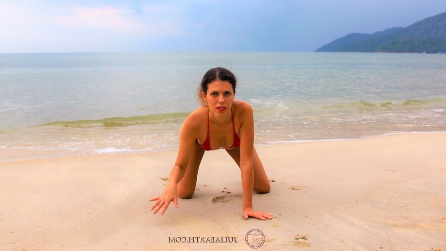 Julia V Earth in red bikini at the beach