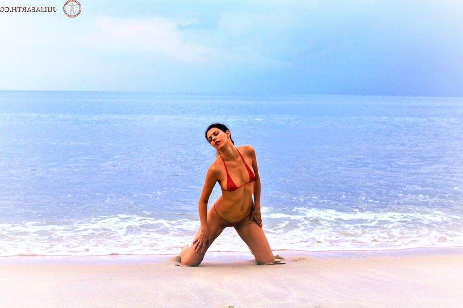 Julia V Earth in red bikini at the beach