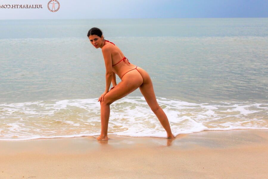 Julia V Earth in red bikini at the beach