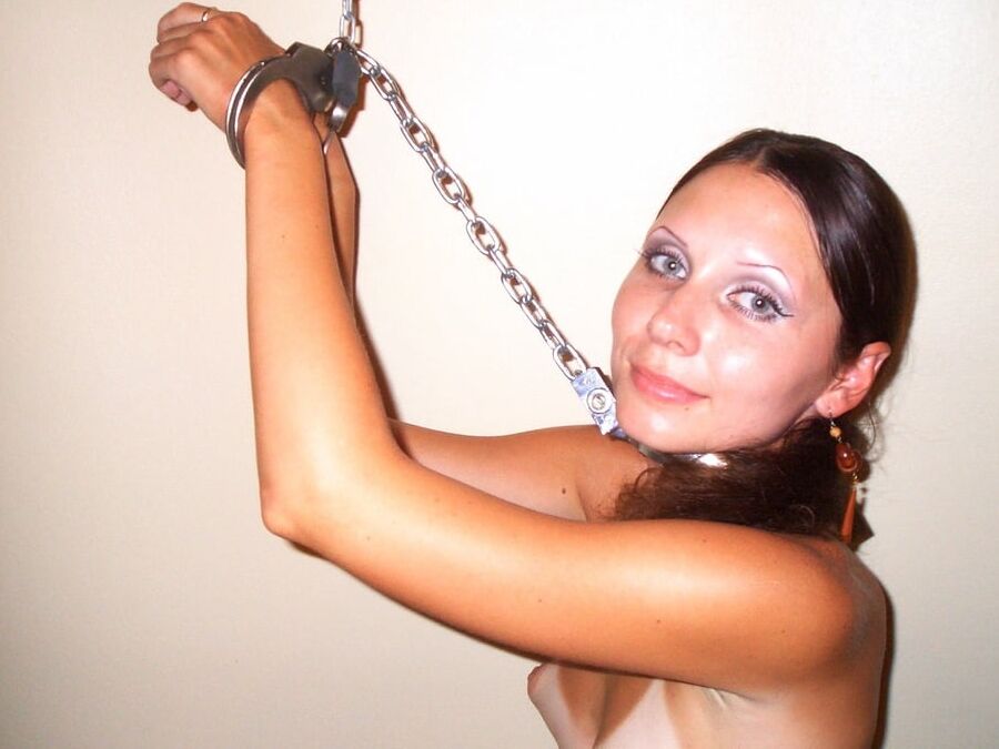 Chained beauty in stockings wants your attention
