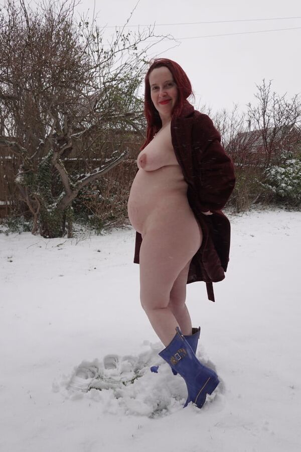Pregnant flashing naked in the cold snow