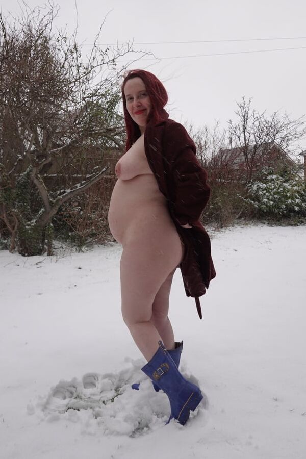 Pregnant flashing naked in the cold snow
