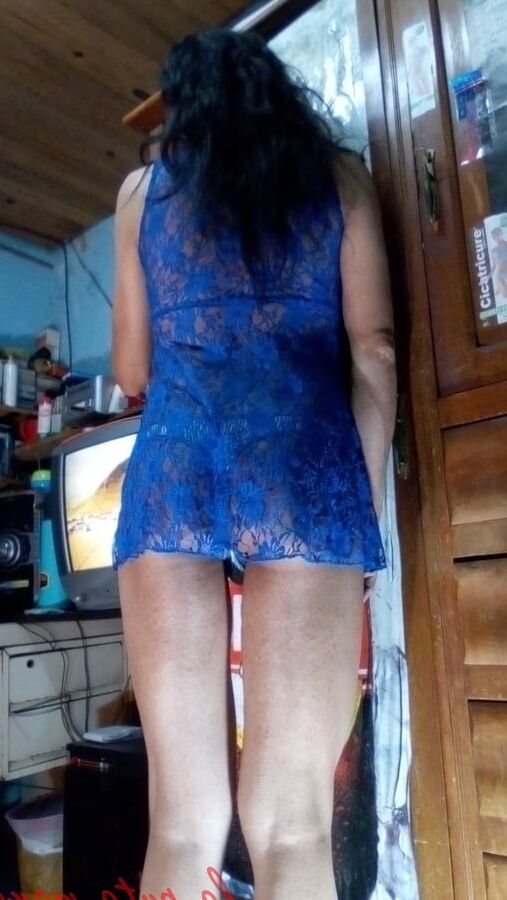 The whore maria wearing a blue dress