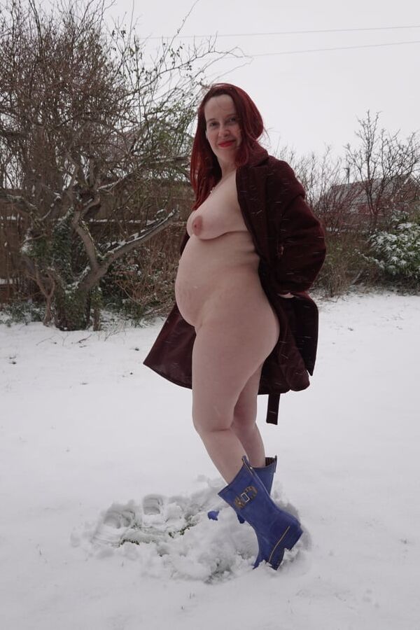 Pregnant flashing naked in the cold snow