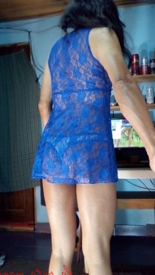 The whore maria wearing a blue dress