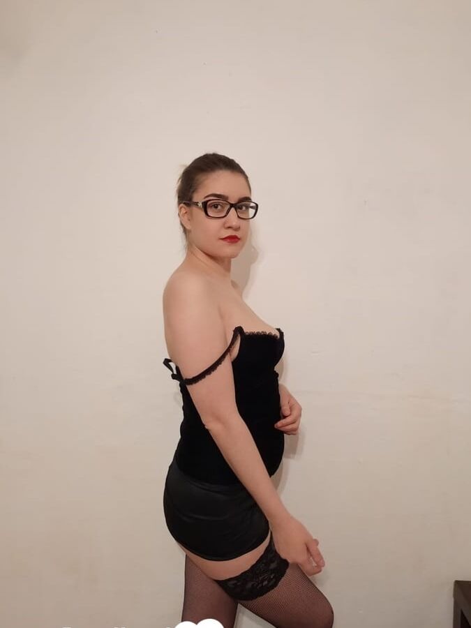Beautiful college girl teasing in black stockings