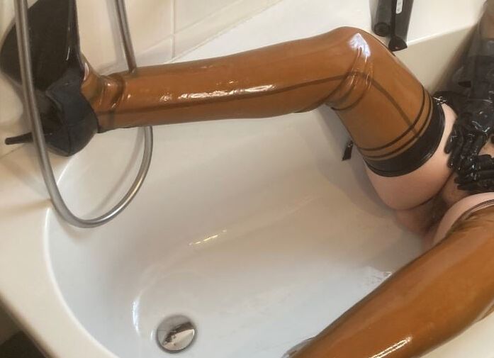 Latex and Dildo in Bath Tub
