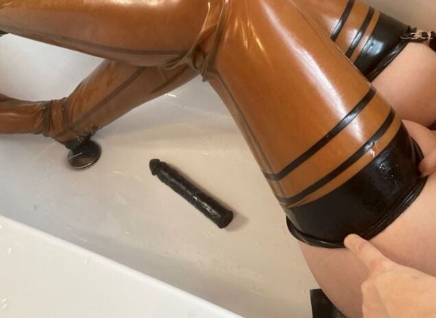 Latex and Dildo in Bath Tub