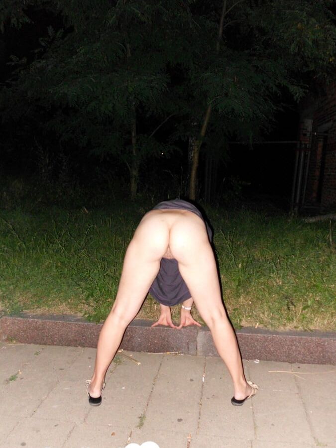 Horny brunette showing her naked body in public
