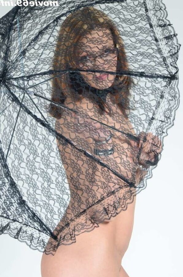MILF Lea Blow smoking nude with a see-through umbrella