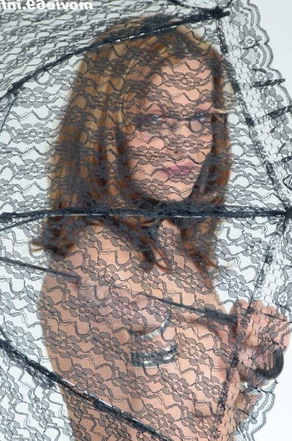 MILF Lea Blow smoking nude with a see-through umbrella
