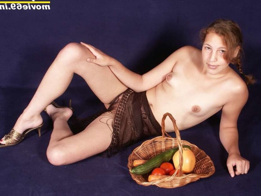 Teen Nathalie has some fun with a carrot and cucumber