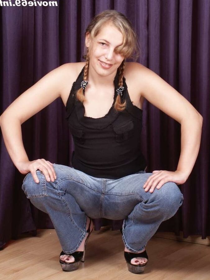 Teen Nathalie poses topless with only jeans and high heels