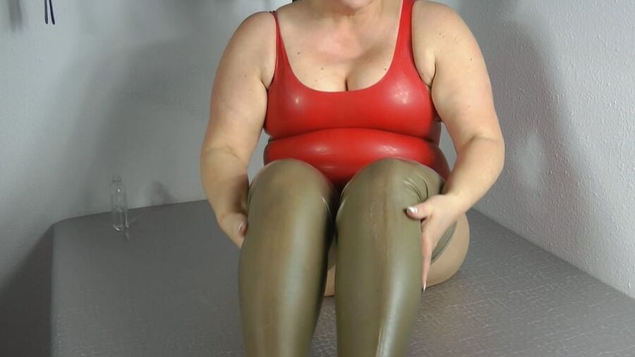 In oiled latex body and latex stockings