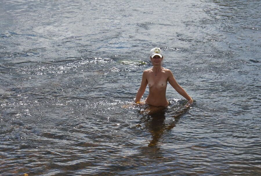 Nude in river's water
