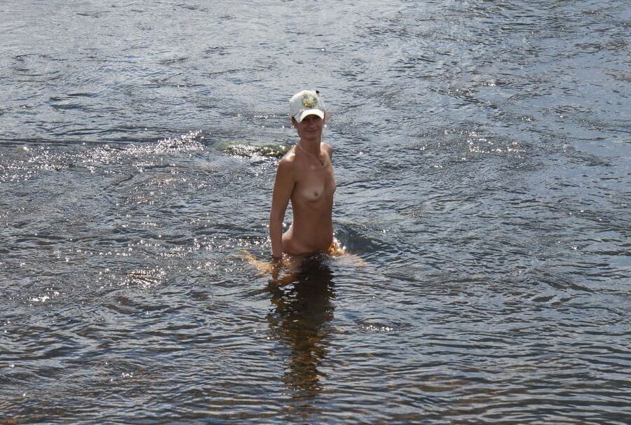 Nude in river's water