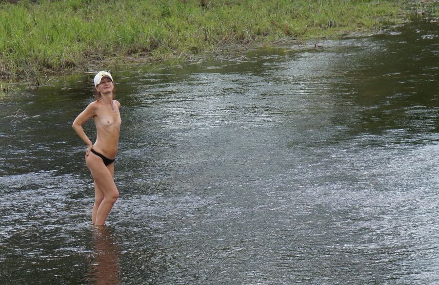 Nude in river's water