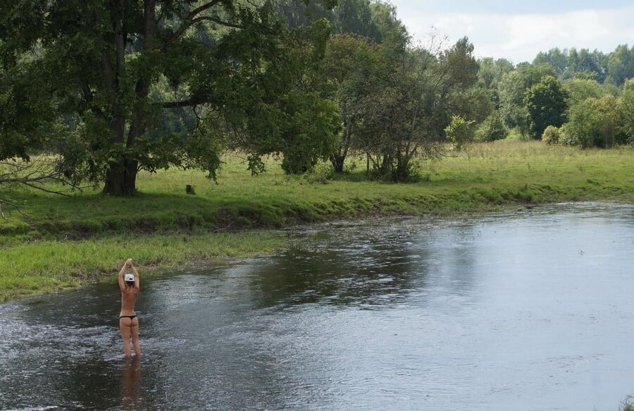Nude in river's water