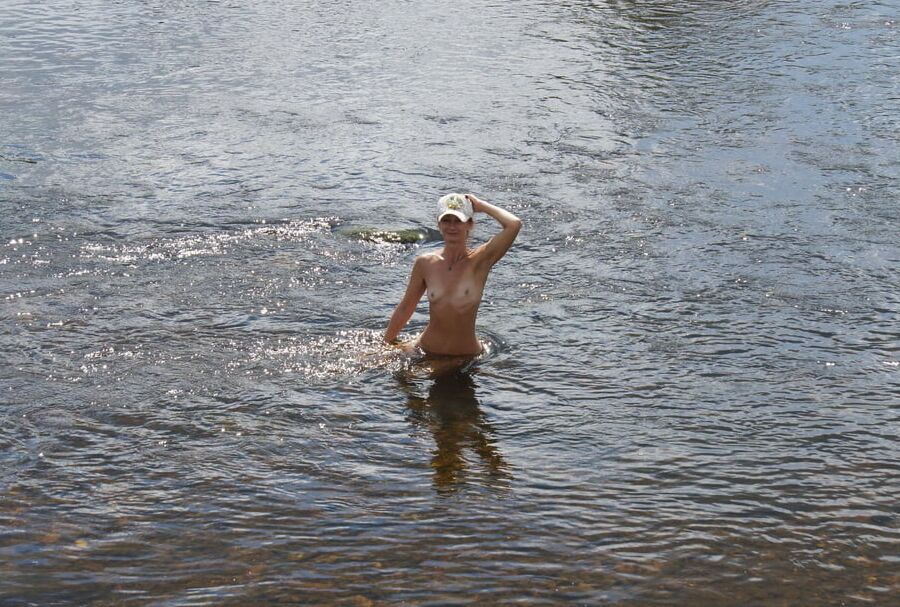 Nude in river's water