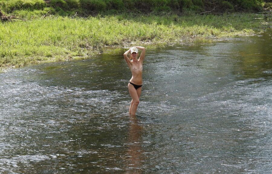 Nude in river's water