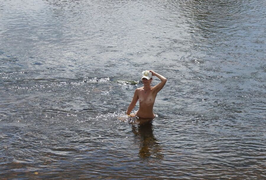 Nude in river's water
