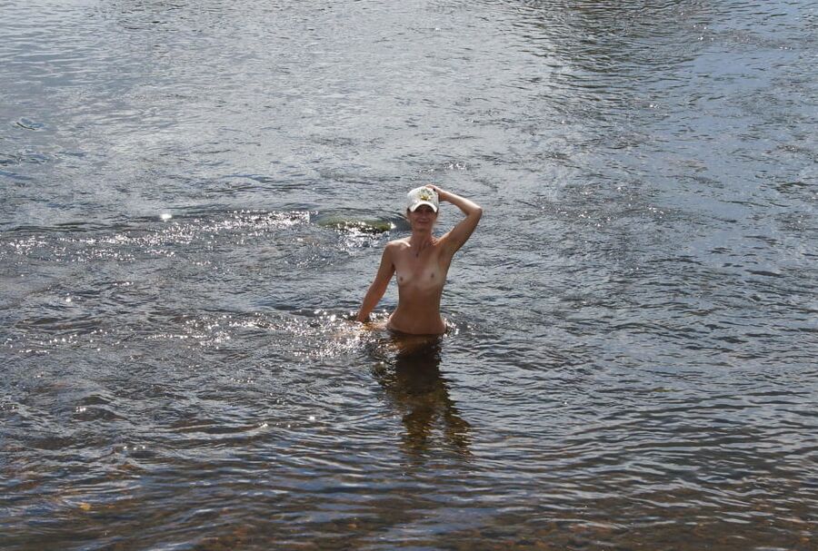 Nude in river's water