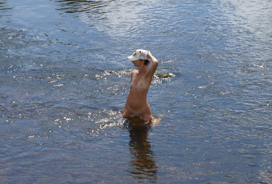 Nude in river's water
