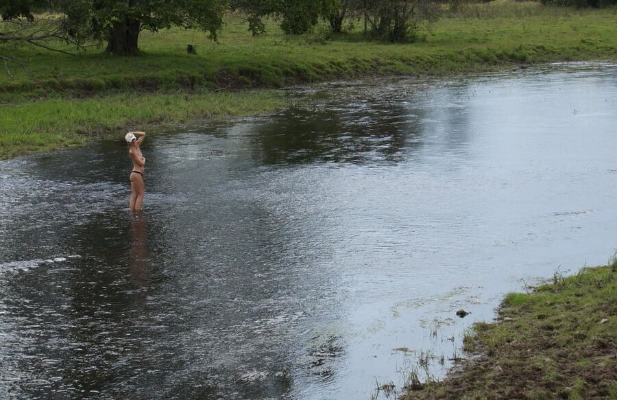 Nude in river's water