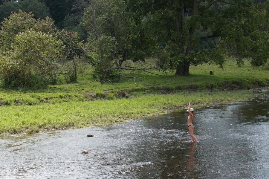 Nude in river's water