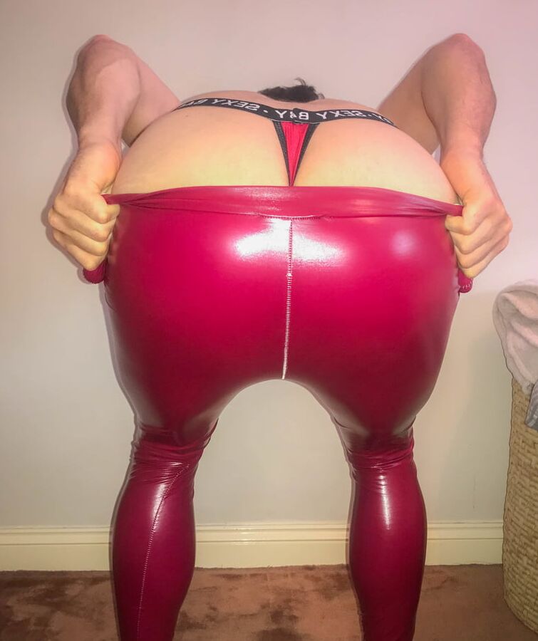 Big ass slut showing off in RED PVC BOOTS