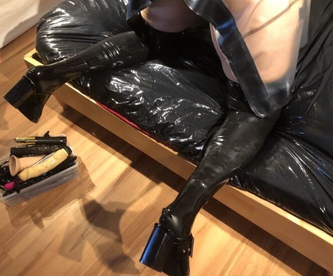 Latex and Dildos on Bed