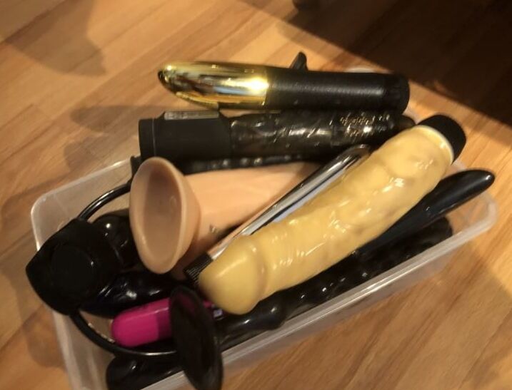 Latex and Dildos on Bed
