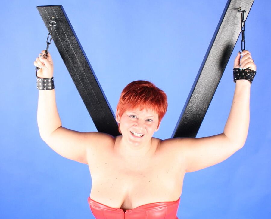 In red fetish outfit