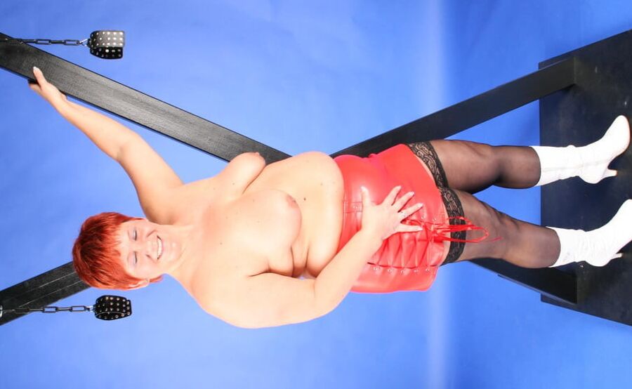 In red fetish outfit