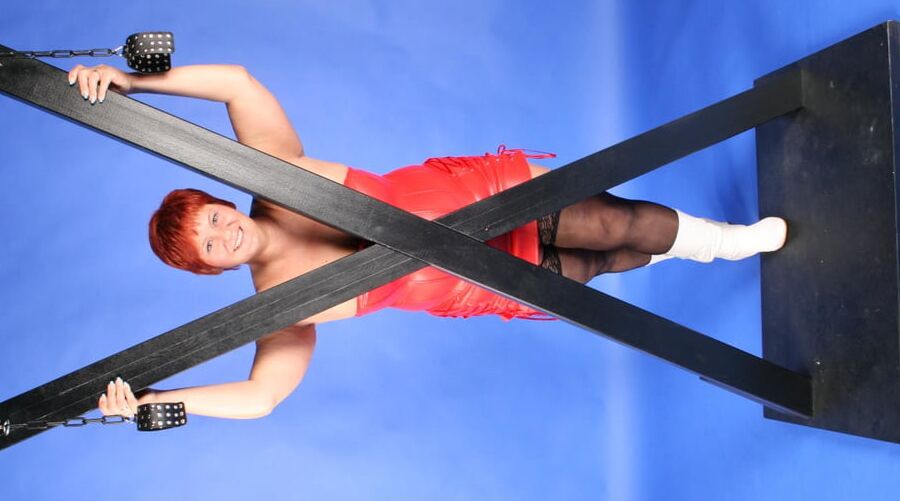 In red fetish outfit