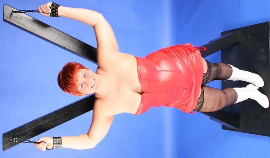 In red fetish outfit