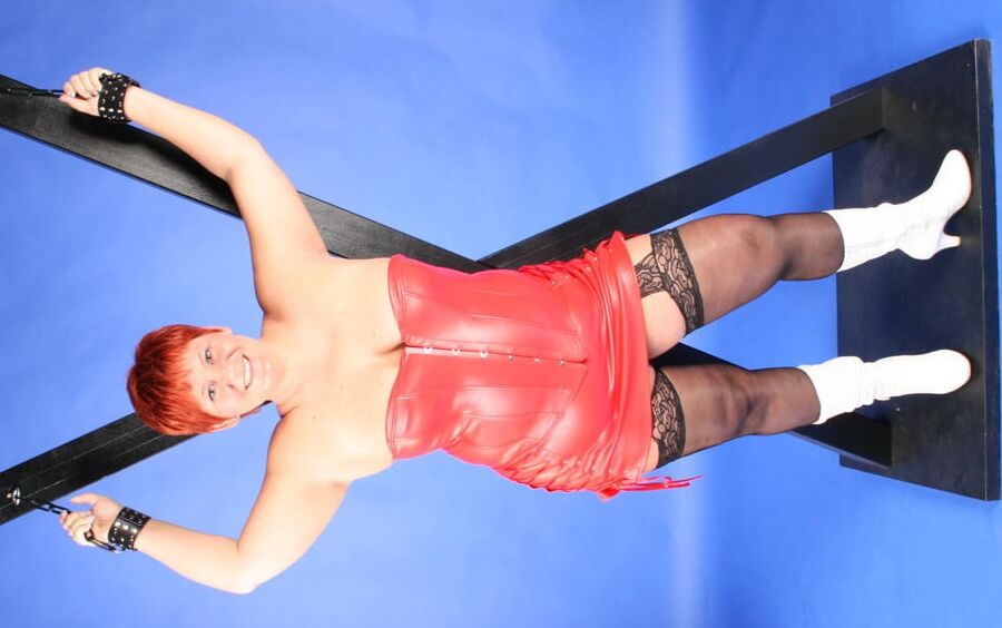 In red fetish outfit