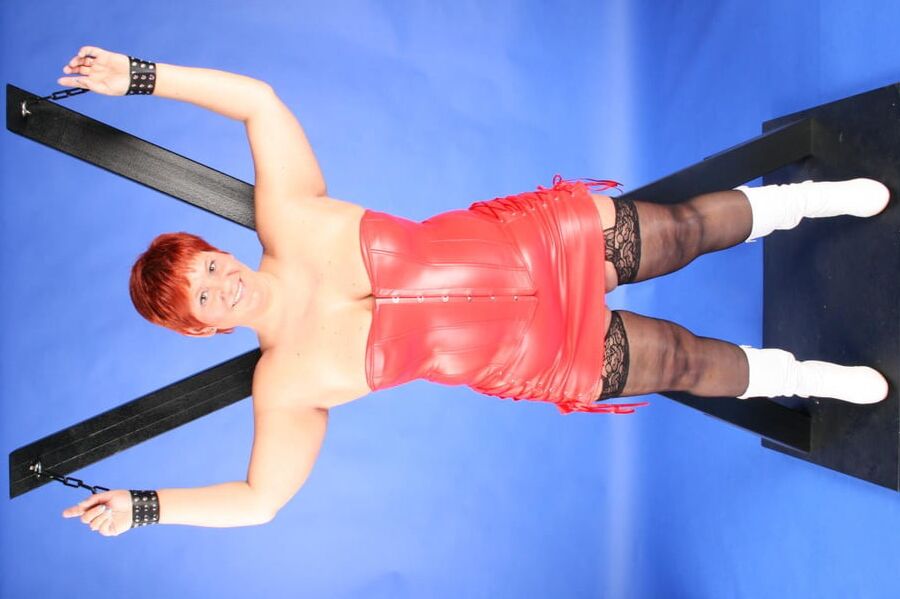 In red fetish outfit