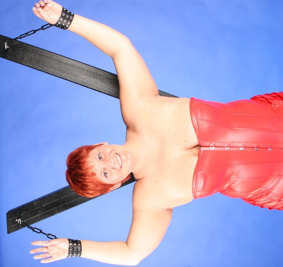 In red fetish outfit