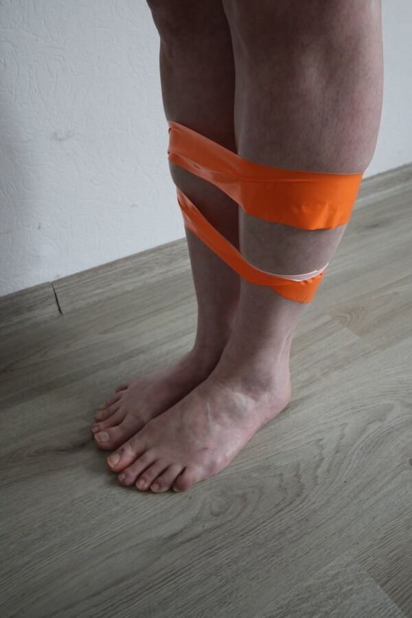 Tape tied bondage