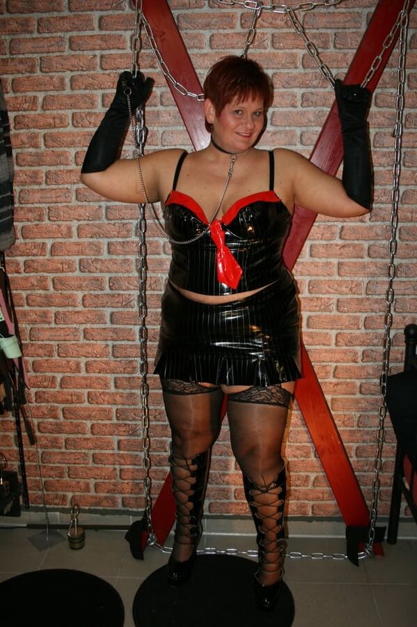 In latex paint outfit on the cross