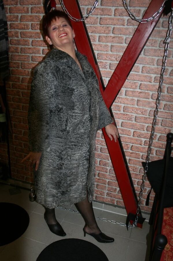 Posing in a gray fur coat