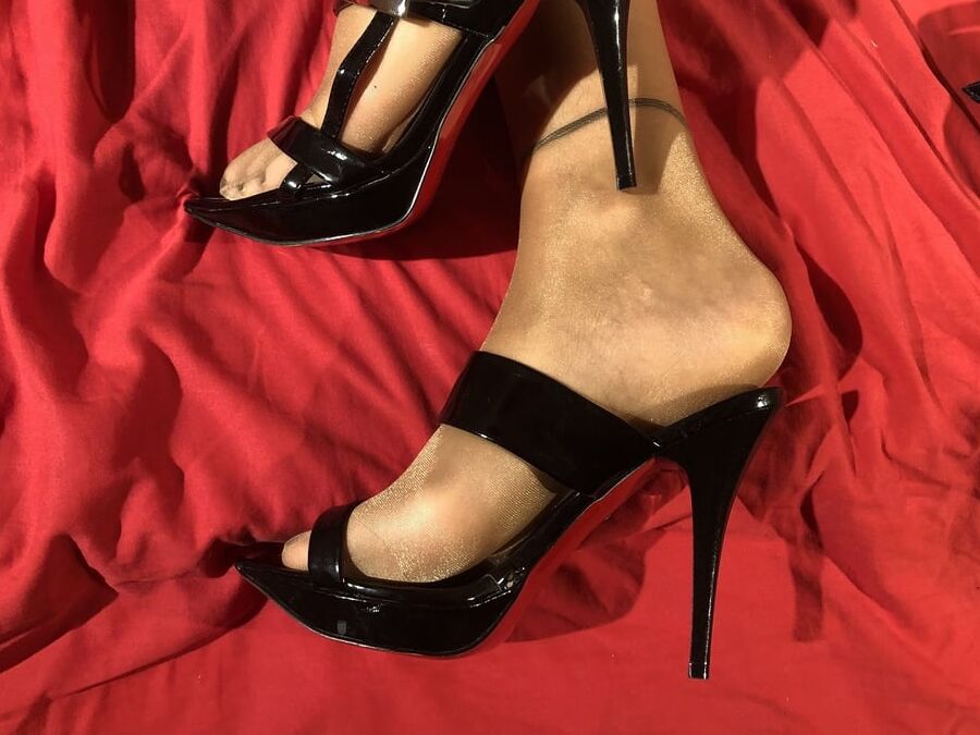 High Heels and Nylons on Bed