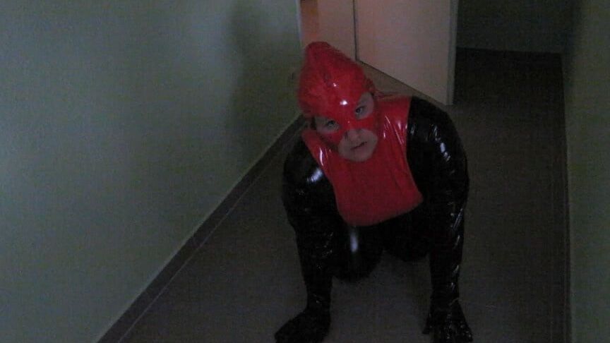 Petplay in latex suit ...