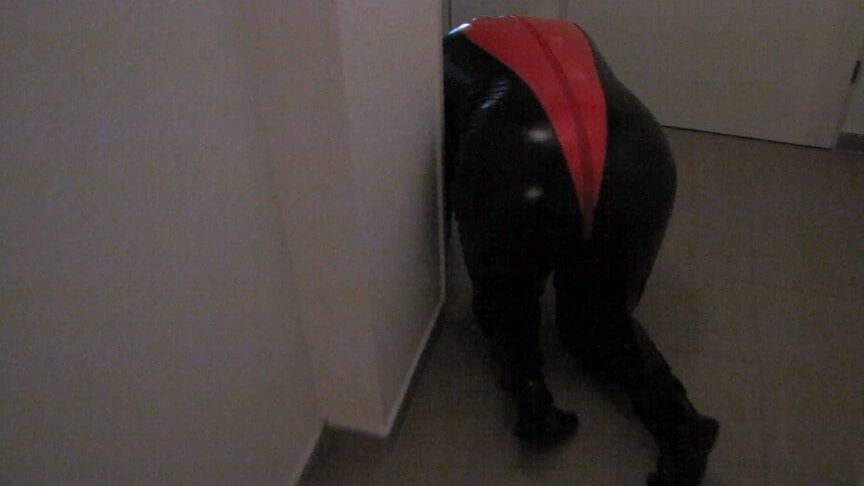Petplay in latex suit ...